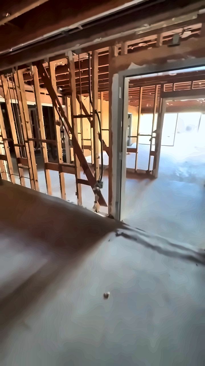 Interior demolition with walls opened to the framing