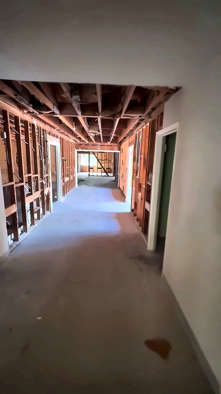 Hallway stripped to studs during an A2Z interior demolition