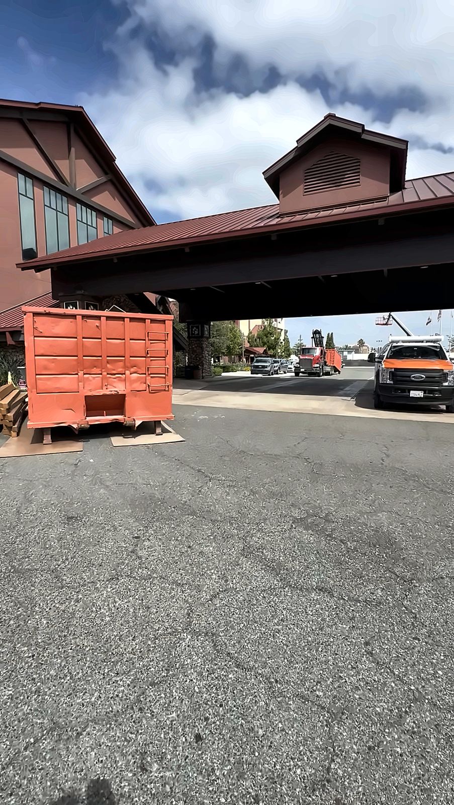 A2Z roll off container staged at a hotel entrance during renovation demolition